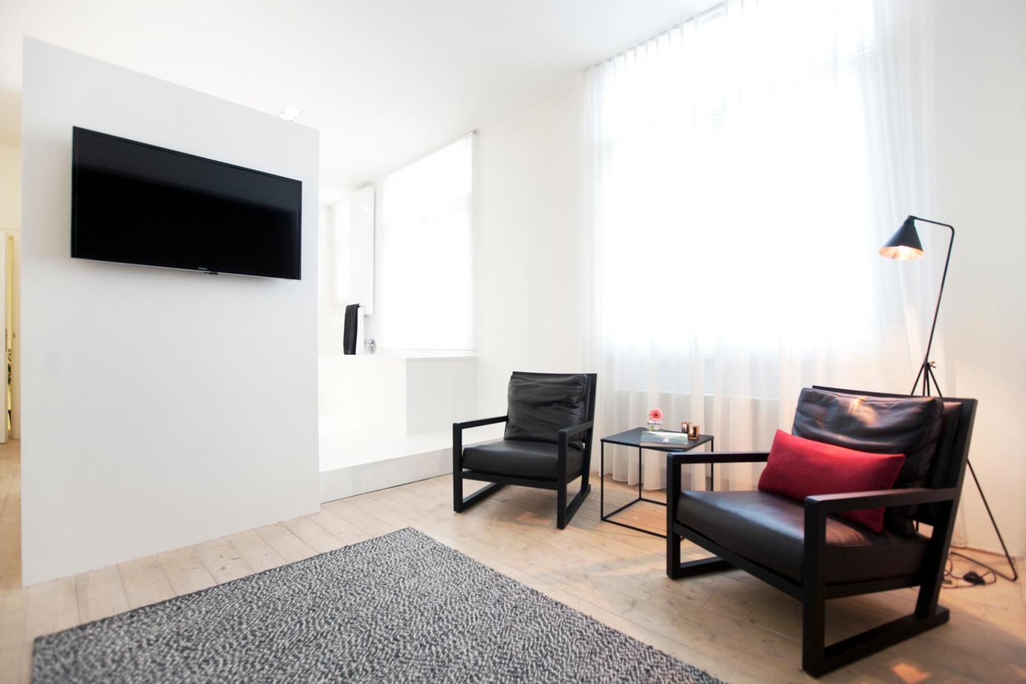 Maison Nationale City Flats & Suites Αμβέρσα Δωμάτιο φωτογραφία A room at the hotel