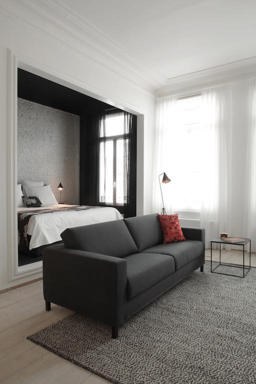 Maison Nationale City Flats & Suites Αμβέρσα Δωμάτιο φωτογραφία A room at the hotel